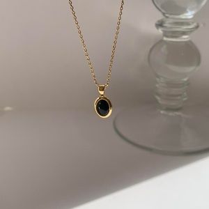 Elegant Gold and Black Onyx Pendant Necklace